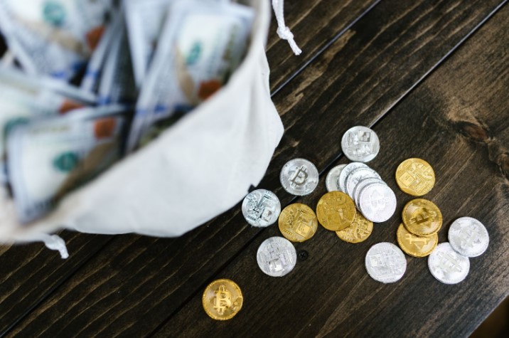 A bag with banknotes and crypto coins