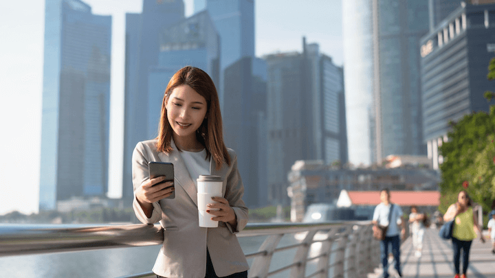 A business person using her phone to text someone