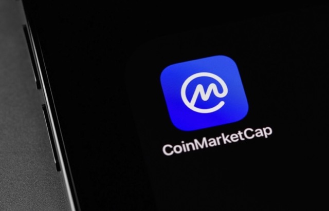 CoinMarketCap logo on someone's mobile phone