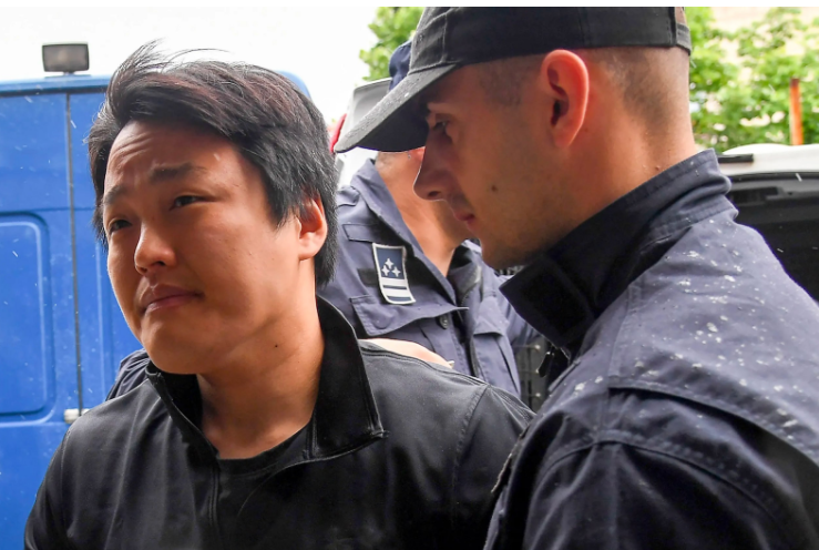 A photo of Do Kwon supervised by police officers