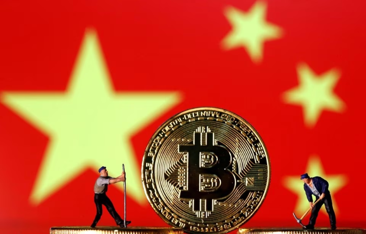 A BTC coin and blurred Chinese flag in the background